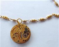 Vintage timepiece rare golden toned watch movement on gold-plated chain
