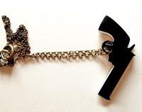 Black china gun necklace on brass long chain