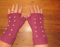 Cranberry fingerless gloves with pearl beads set in small cables.